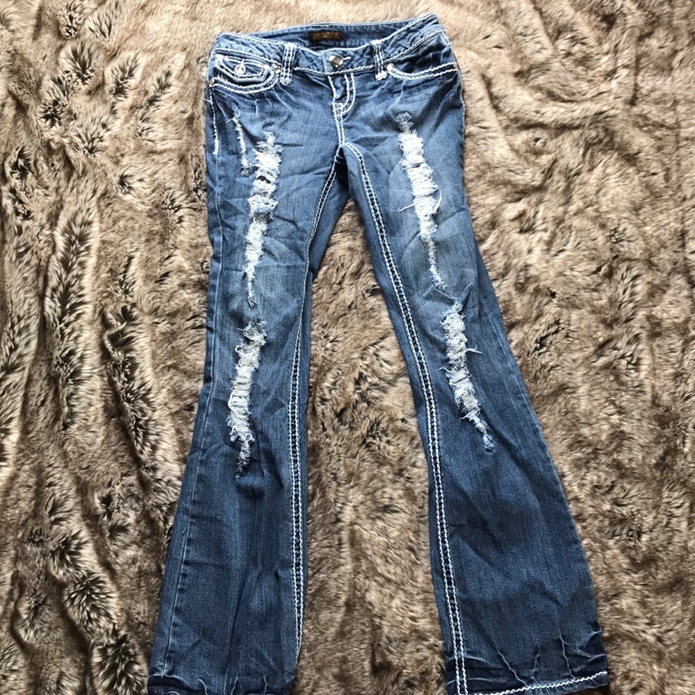 Distressed boot cut jeans